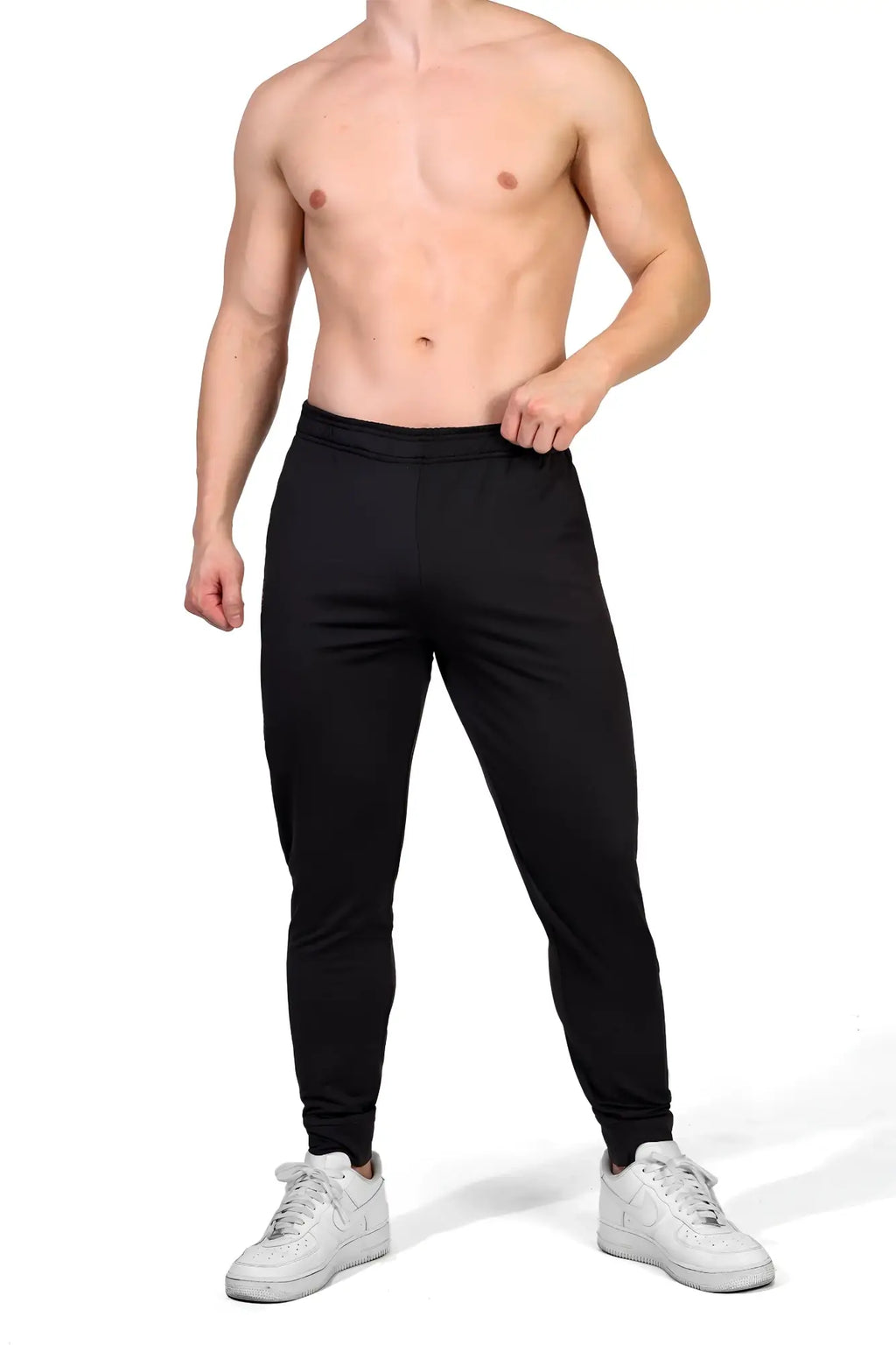 Black peek-a-boo joggers with a snug fit and elastic cuffs designed for athletic use