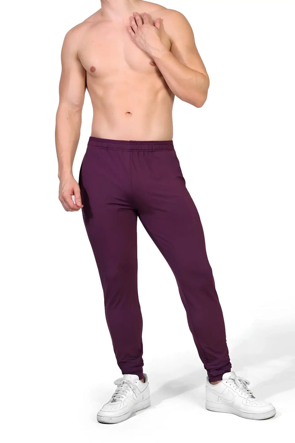 Mauve slim-fit peek-a-boo joggers with elastic waistband and tapered legs in plum purple for casual wear