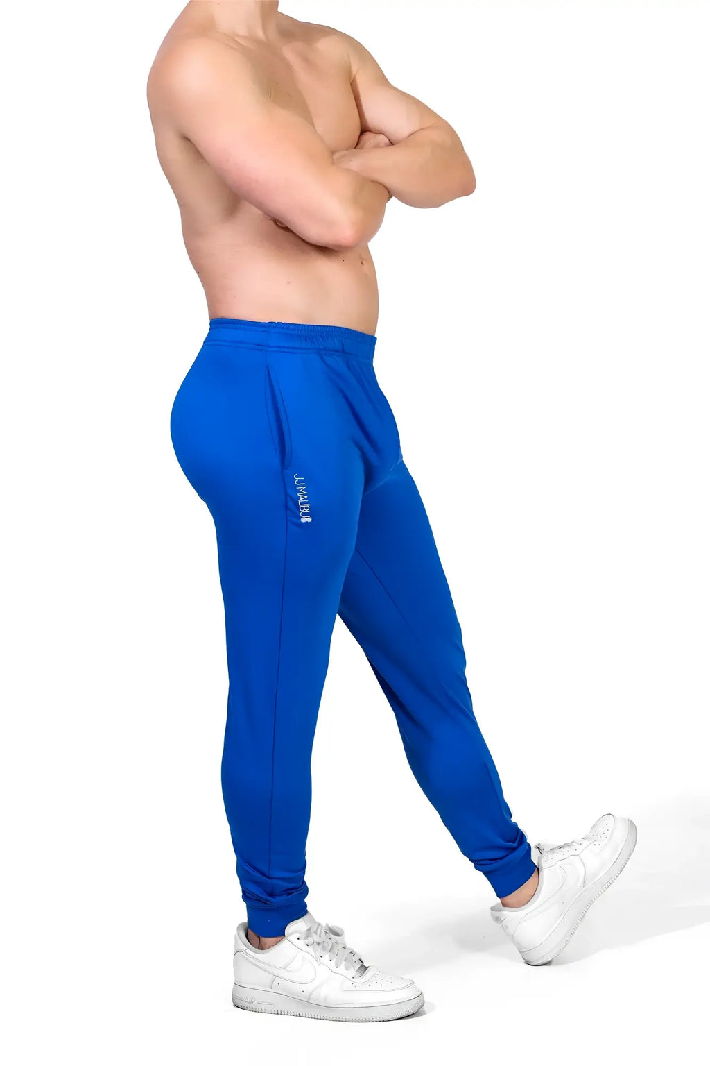Peek-a-boo joggers royal blue bright blue slim fit athletic pants with elastic cuffs and white logo on left thigh