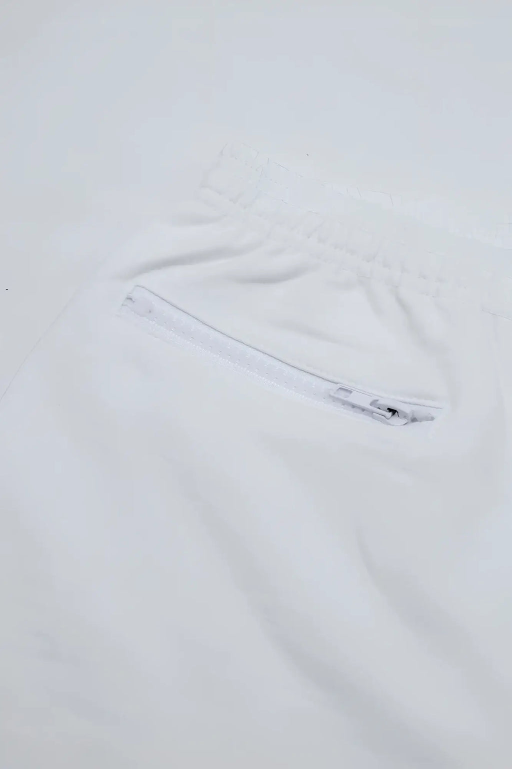 White peek-a-boo varsity 2 inch short shorts with front zippered pocket and drawstring waist in marshmallow color