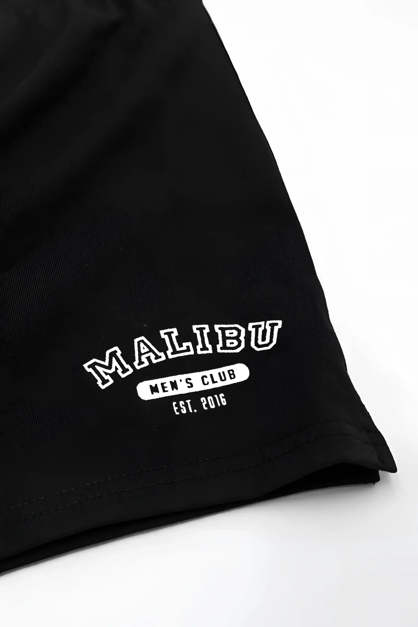 Black cotton peek-a-boo varsity 2 inch short shorts in midnight with white embroidered malibu men’s club est design