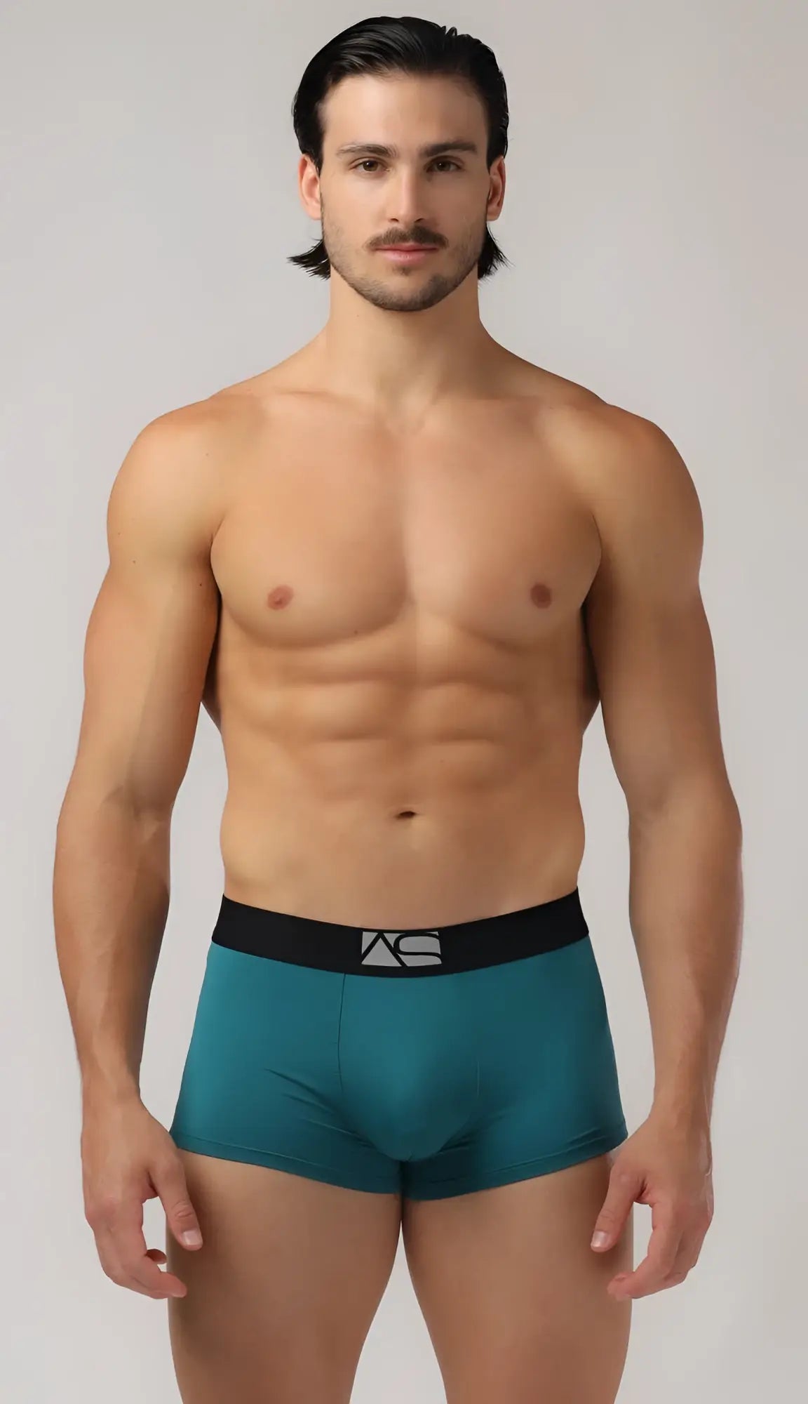 Teal men’s perfect boyshorts with black elastic waistband and silver logo featuring soft breathable fabric