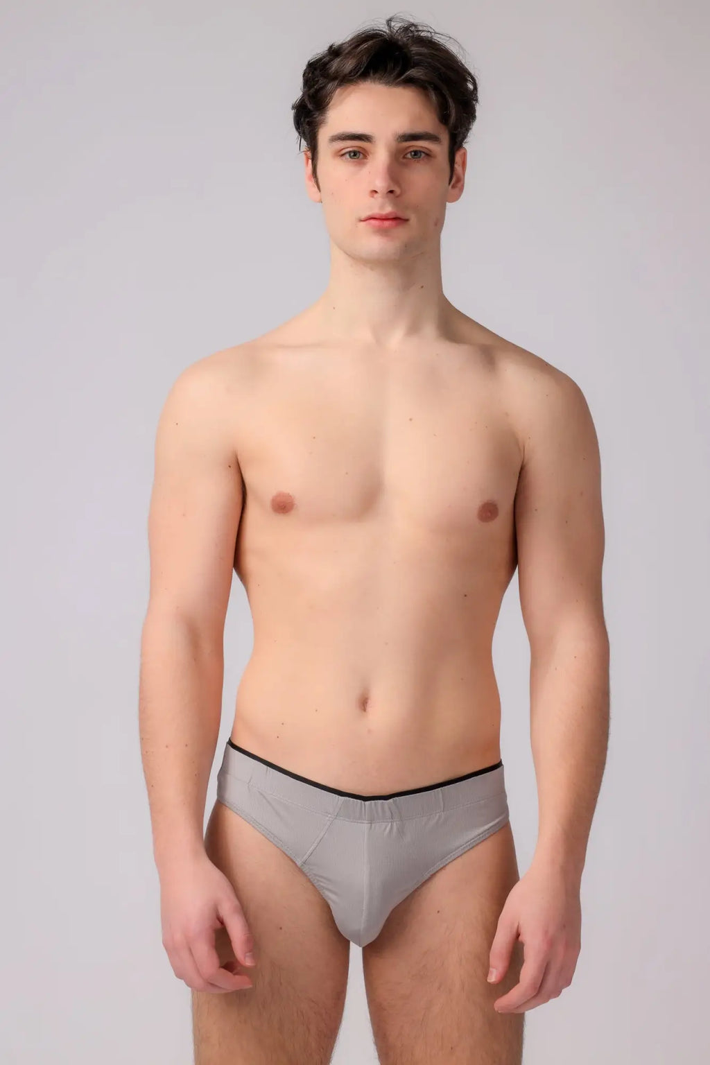 Gray as performance thong briefs with black elastic waistband designed for comfort and active wear