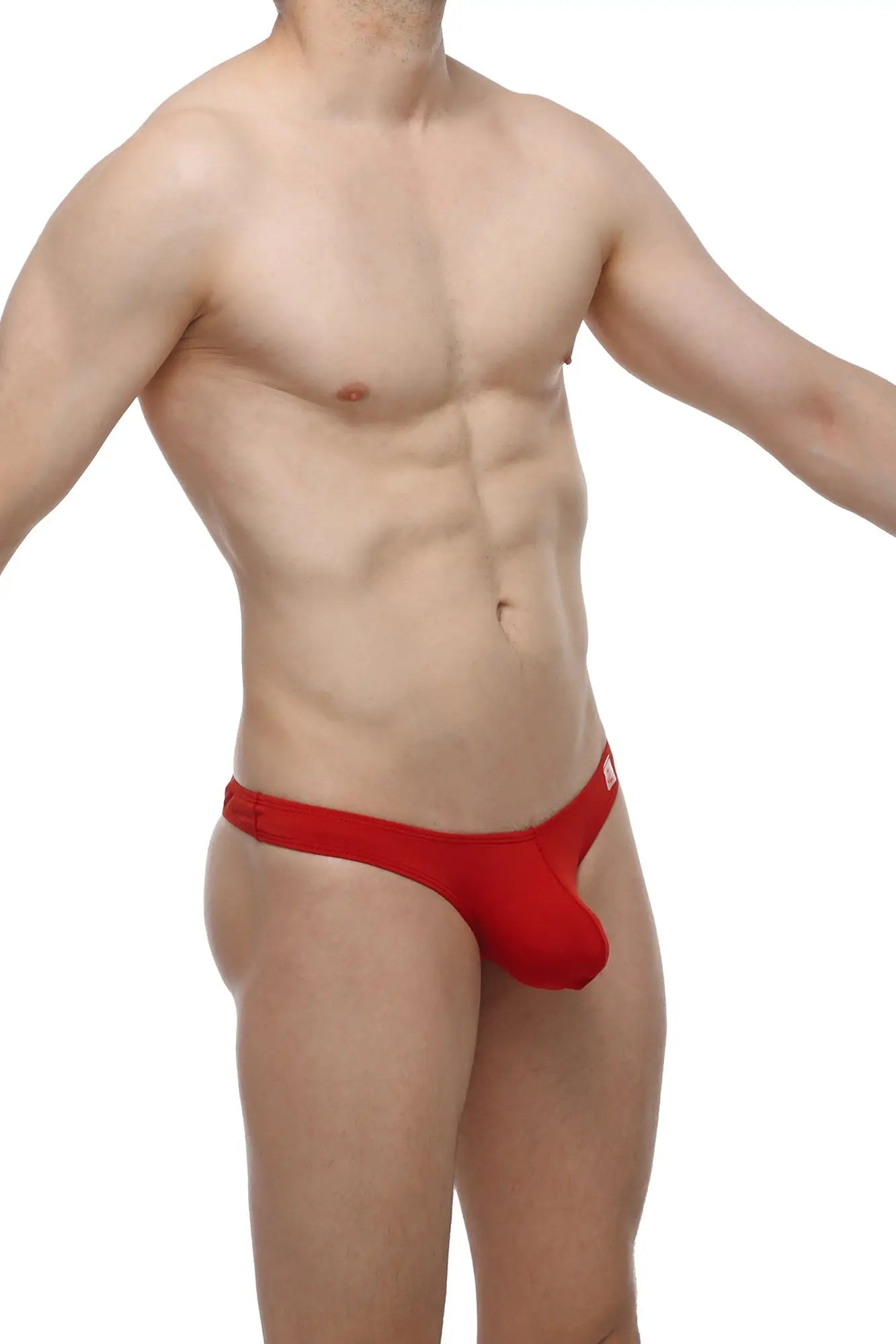 Red petitq bikini capri thong in smooth fabric with form-fitting minimalistic design shown from the back side