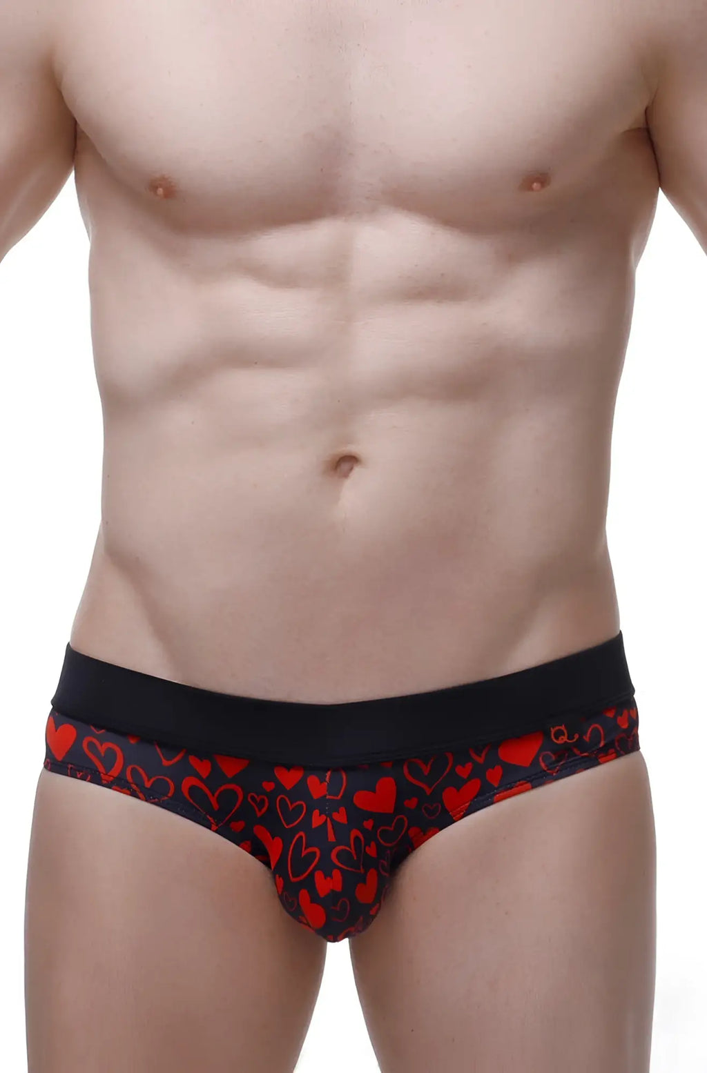 Black briefs with a vibrant red heart pattern from petitq bikini céron king of hearts collection