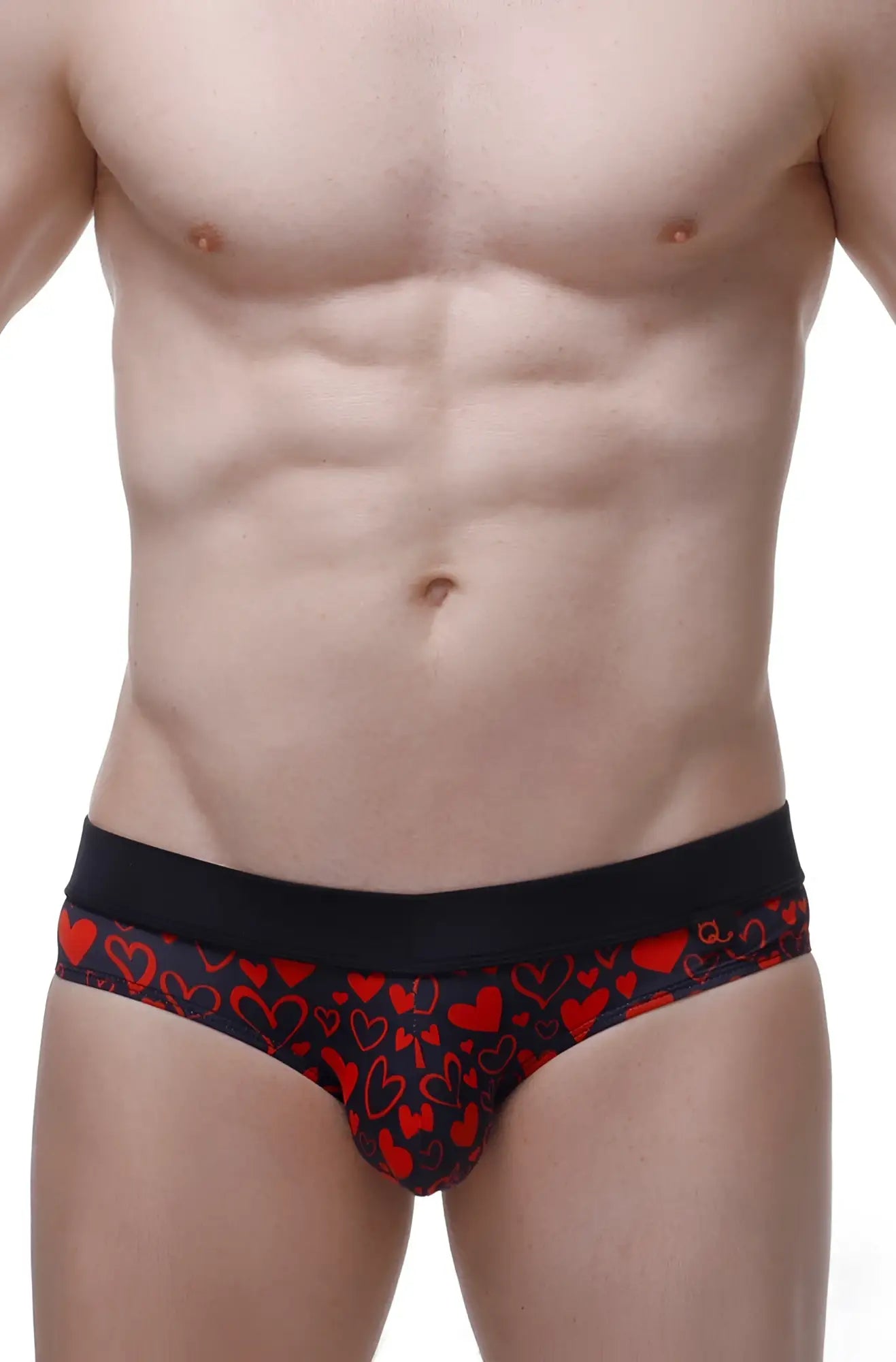 Black briefs with a vibrant red heart pattern from petitq bikini céron king of hearts collection