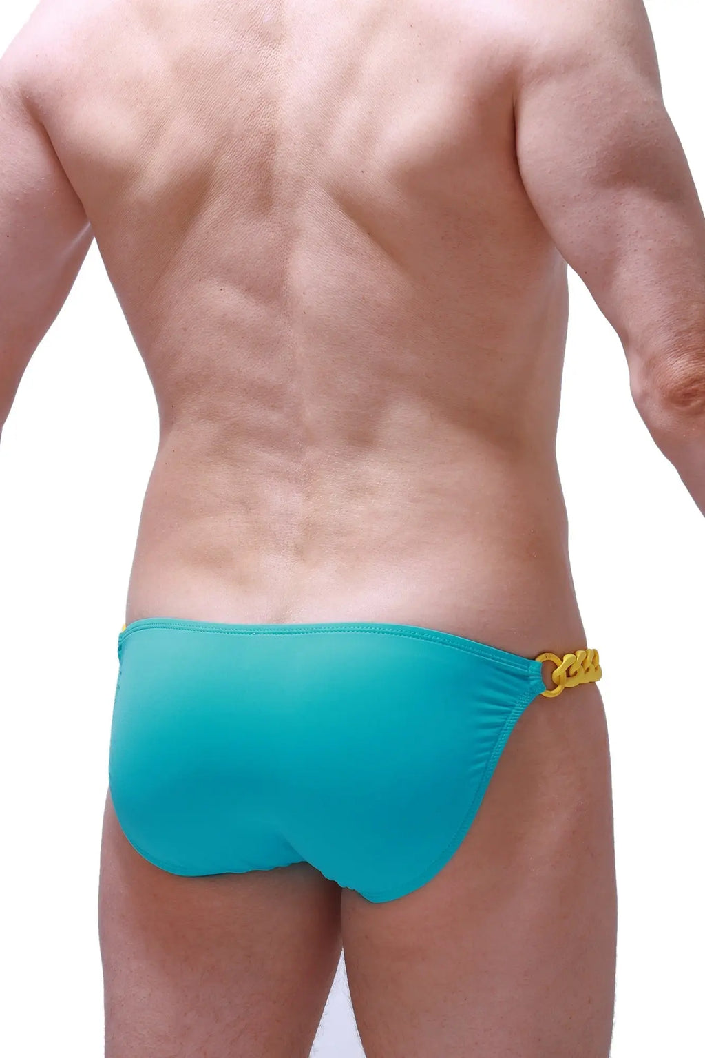 Turquoise swim trunks with yellow chain detail on the side from PetitQ Bikini Chains Green collection