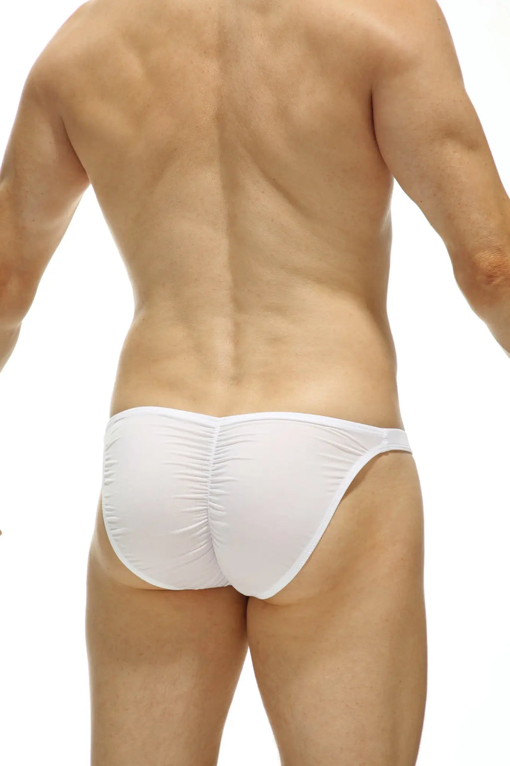 White petitq bikini cornil bulan swim trunks shown from the back with form-fitting ruched design