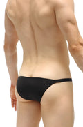 Black petitq bikini cornil thong made of smooth stretchy fabric shown from the back