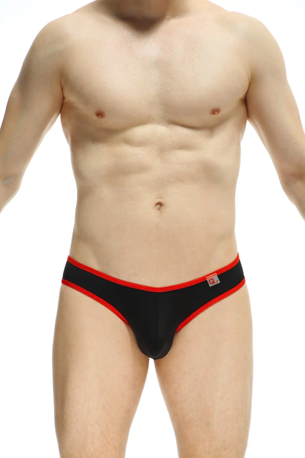 Black briefs with red trim and a small logo on the waistband from petitq bikini loisail red collection