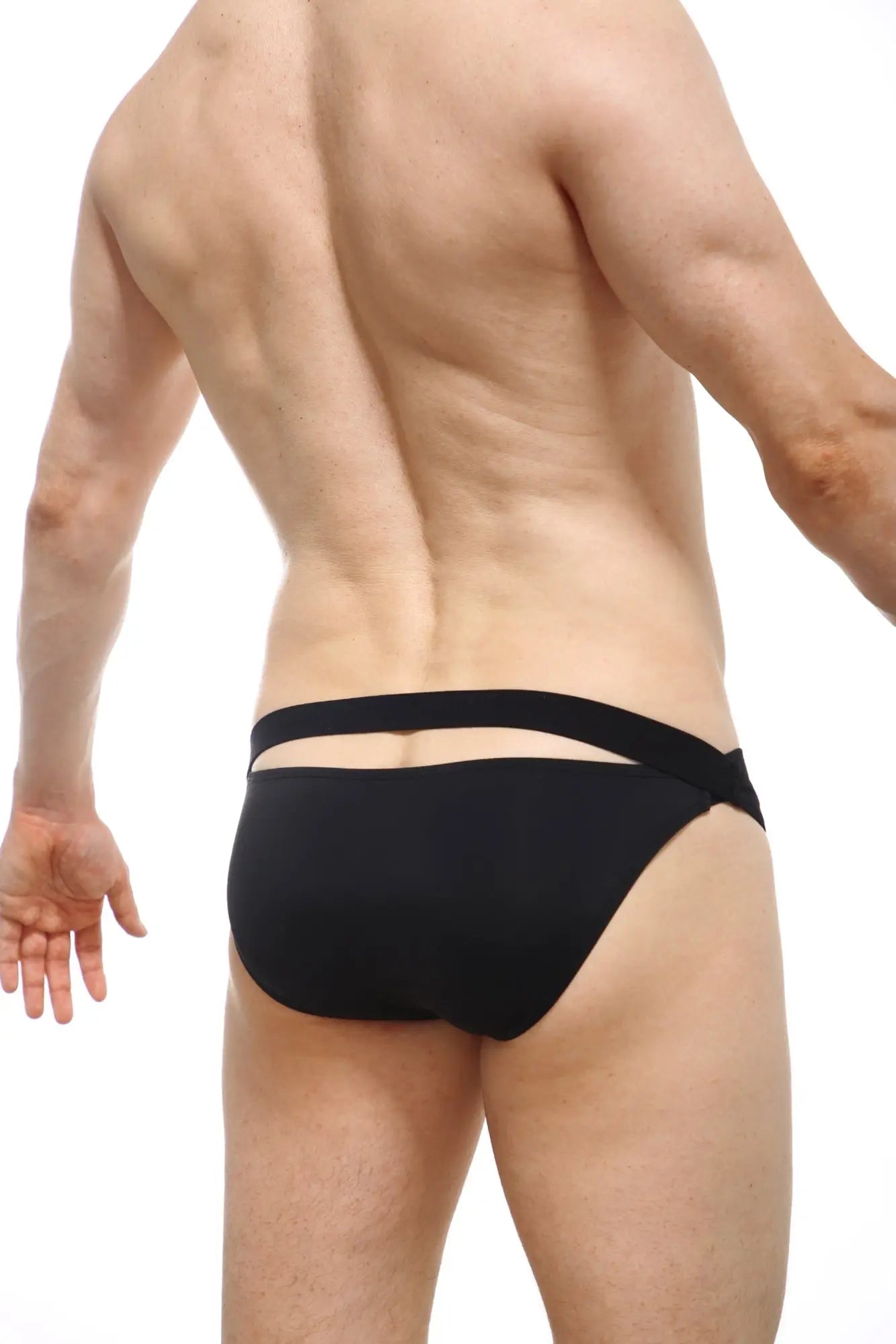 Black petitq bikini mardie swim trunks with two horizontal elastic bands on the back in a sleek modern design