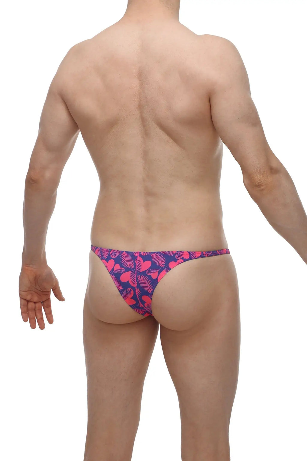 Vibrant pink and purple tropical leaf-patterned swim trunks from PetitQ bikini plellis tropical hearts collection