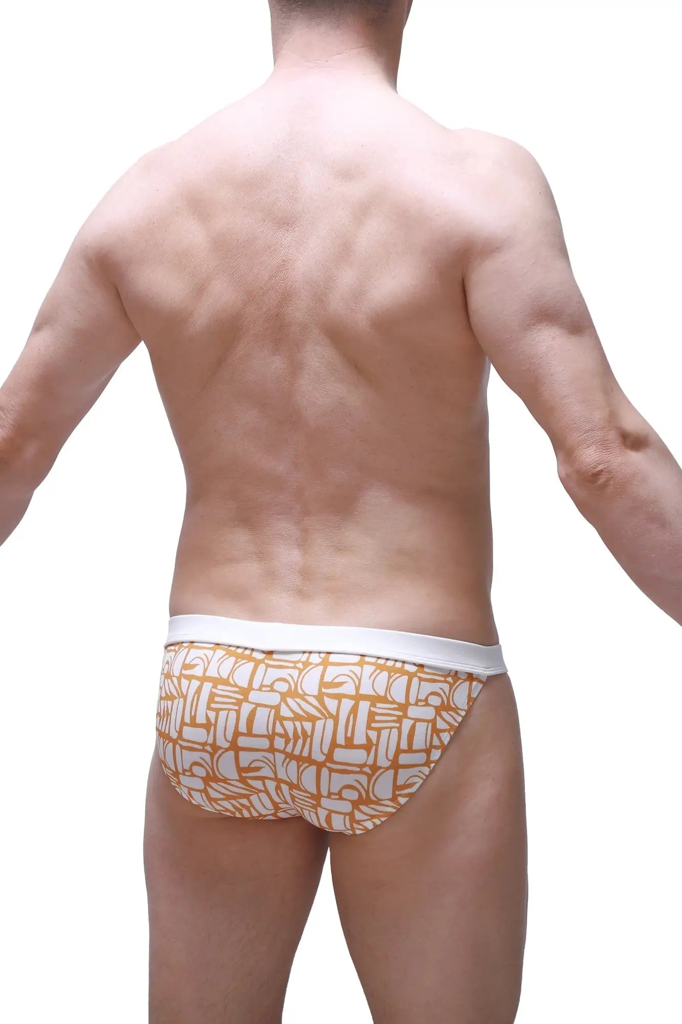 Orange and white patterned briefs with a geometric design from petitq bikini sillas carlot alloy collection