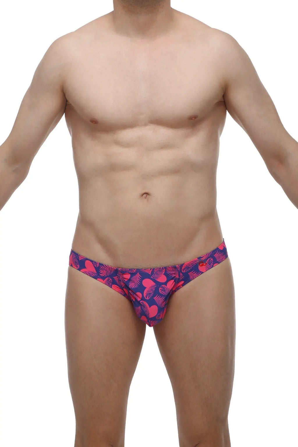 Vibrant pink and navy blue petitq bikini taik swim trunks with tropical leaf pattern ideal for beachwear