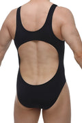 Back view of petitq bodybrief open black one-piece swimsuit with large circular cutout detail