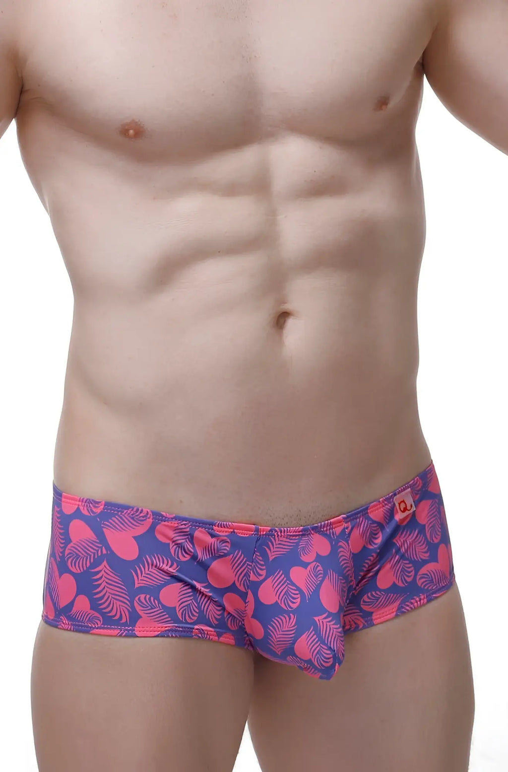PetitQ boxer chill tropical hearts men’s briefs with vibrant pink and purple tropical leaf pattern and red logo waistband