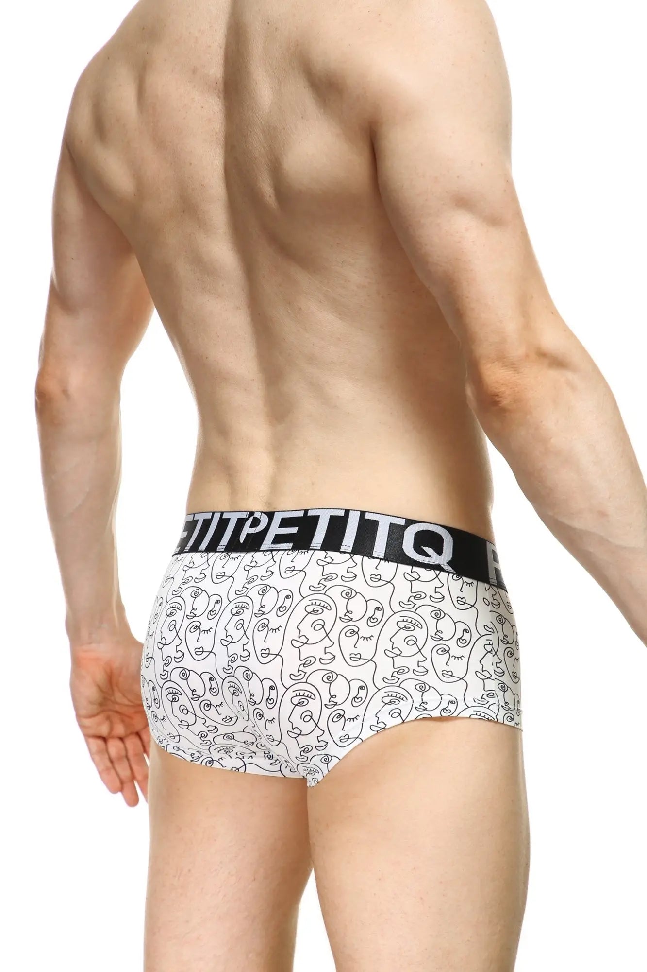 Petitq boxer visage white briefs with black line art faces and bold white petitq branding on elastic waistband