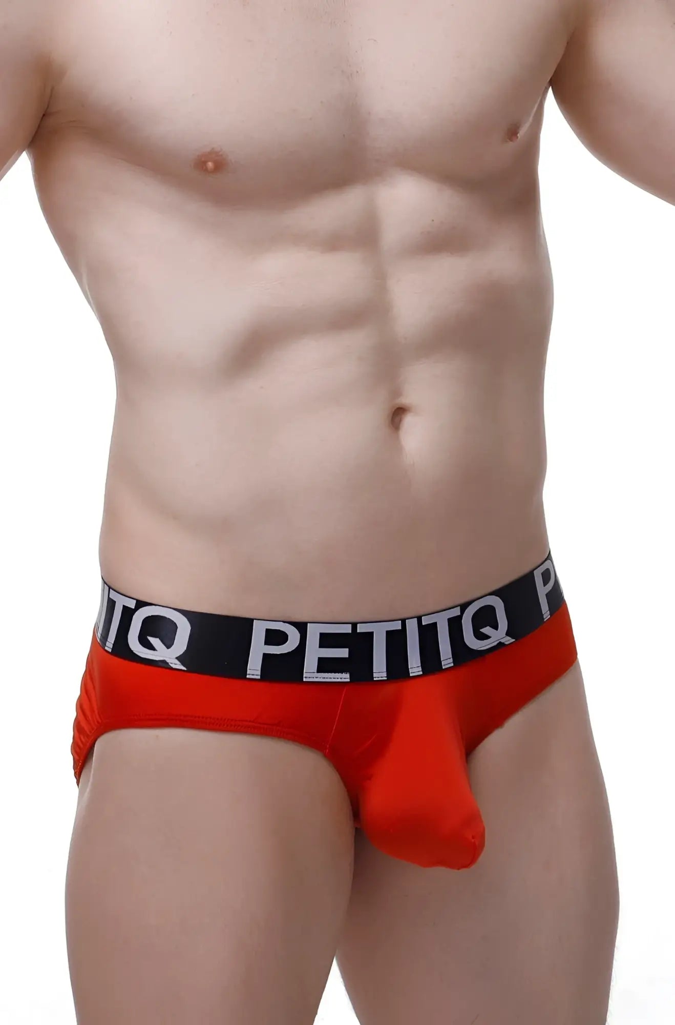 Red petitq men’s briefs with a black waistband featuring white lettering from the petitq brief bulan plum red collection