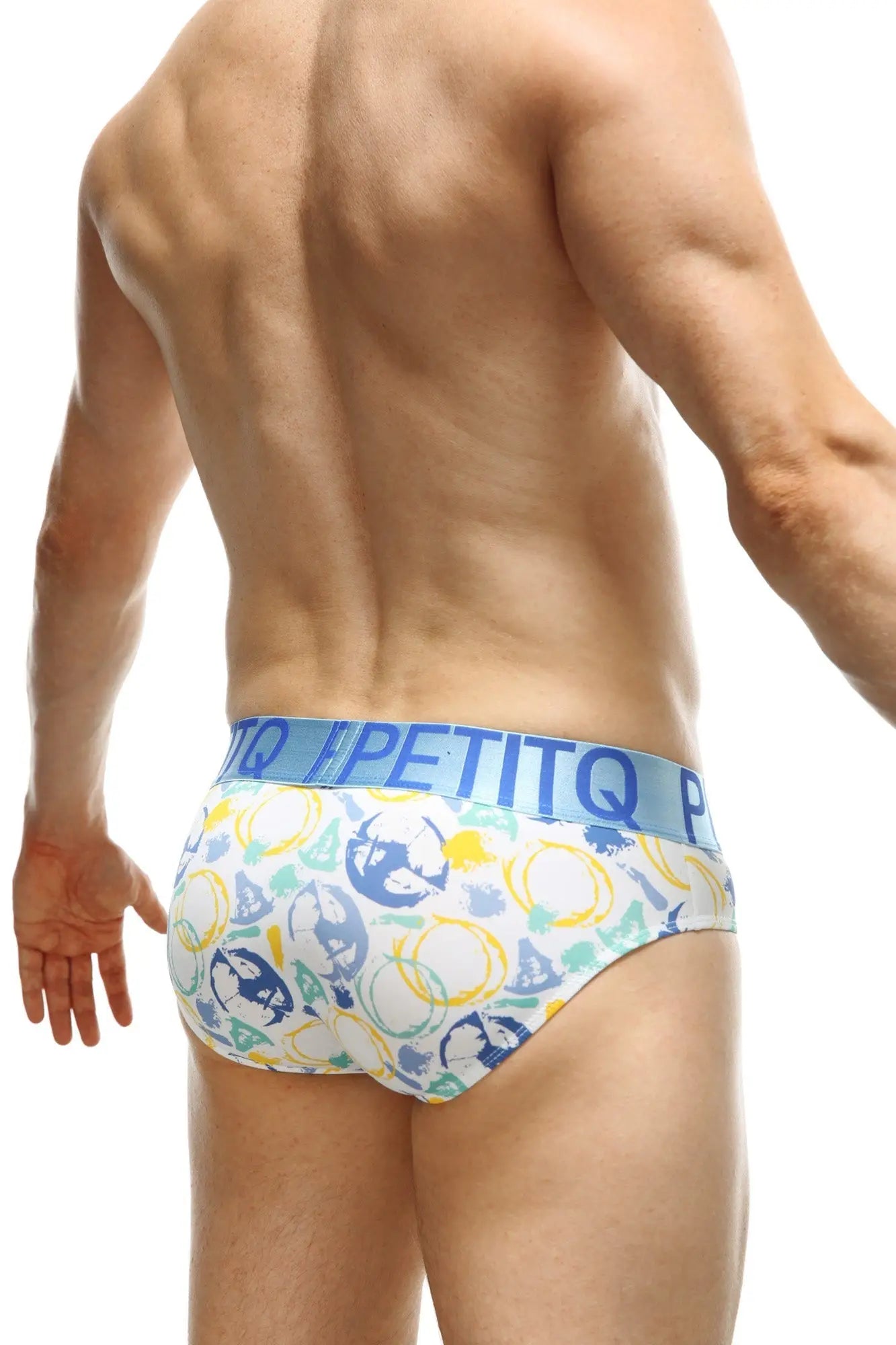 White petitq brief circles with playful blue yellow and green geometric shapes skulls and light blue waistband