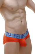 Orange PetitQ men’s briefs with double pouch in modal fabric and light blue waistband featuring brand name