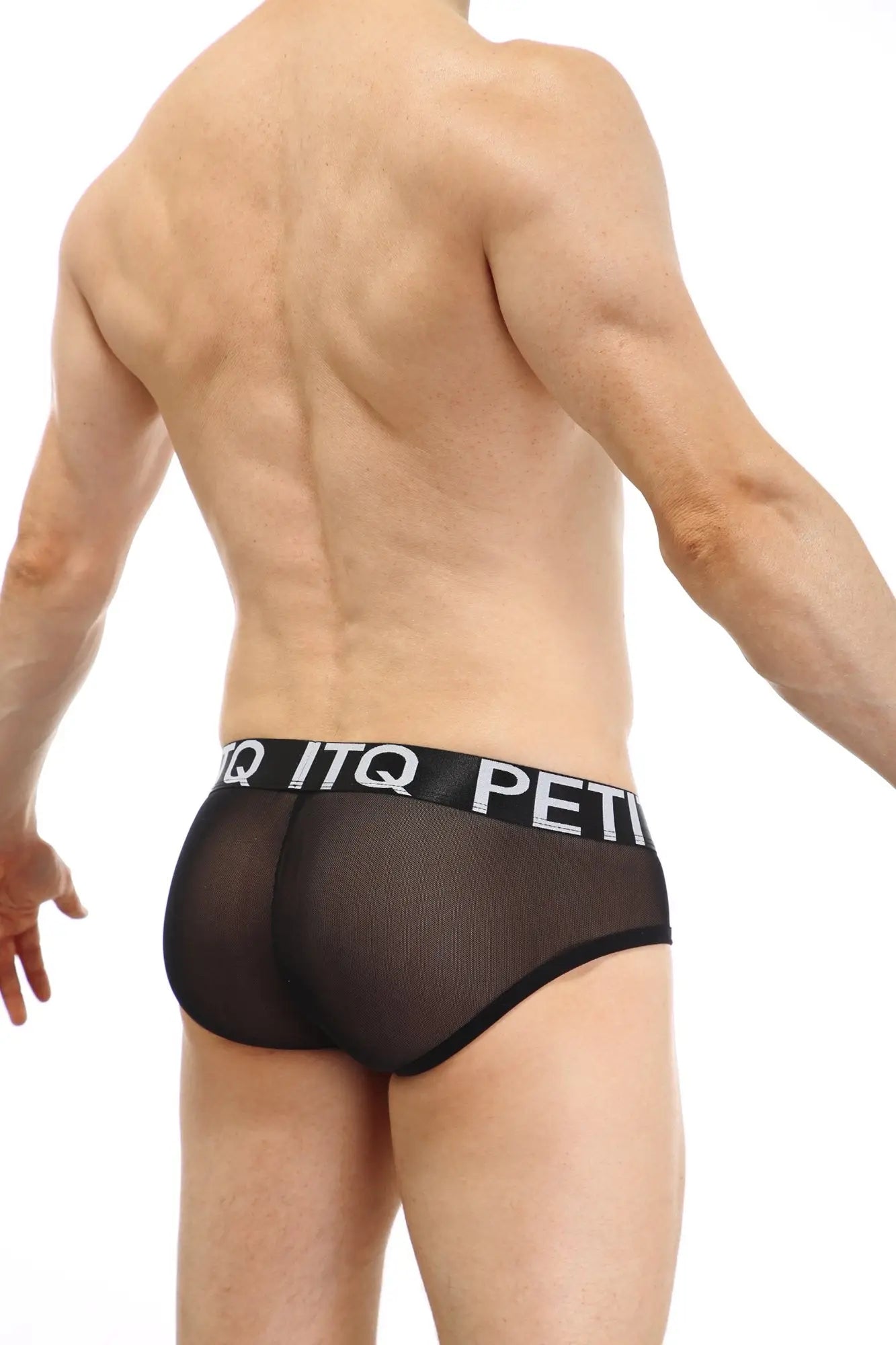 Black sheer mesh briefs with a black elastic waistband featuring white petitq lettering from petitq brief double pouch sitges