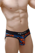 PetitQ Brief Temae vibrant tropical palm tree patterned men’s briefs in bold orange and blue with black petitq waistband