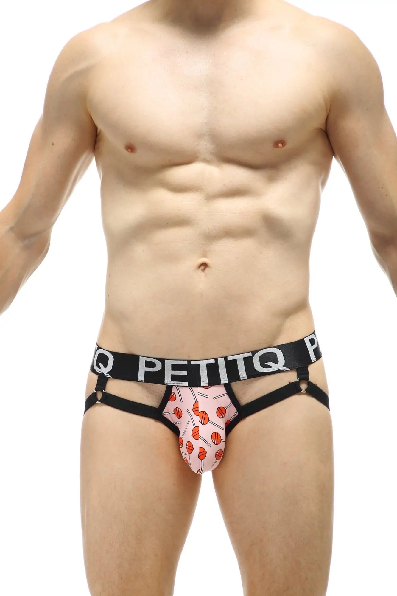 Pink lollipop patterned men’s briefs with black elastic waistband and side straps by petitq jockstrap ciran lollipop