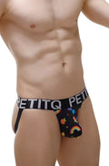 Black petitq men’s briefs with a playful rainbow and fruit pattern on the front from the petitq jockstrap taik sitges collection