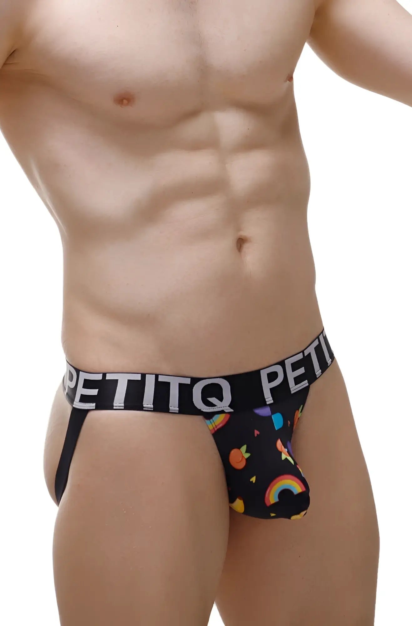 Black petitq men’s briefs with a playful rainbow and fruit pattern on the front from the petitq jockstrap taik sitges collection