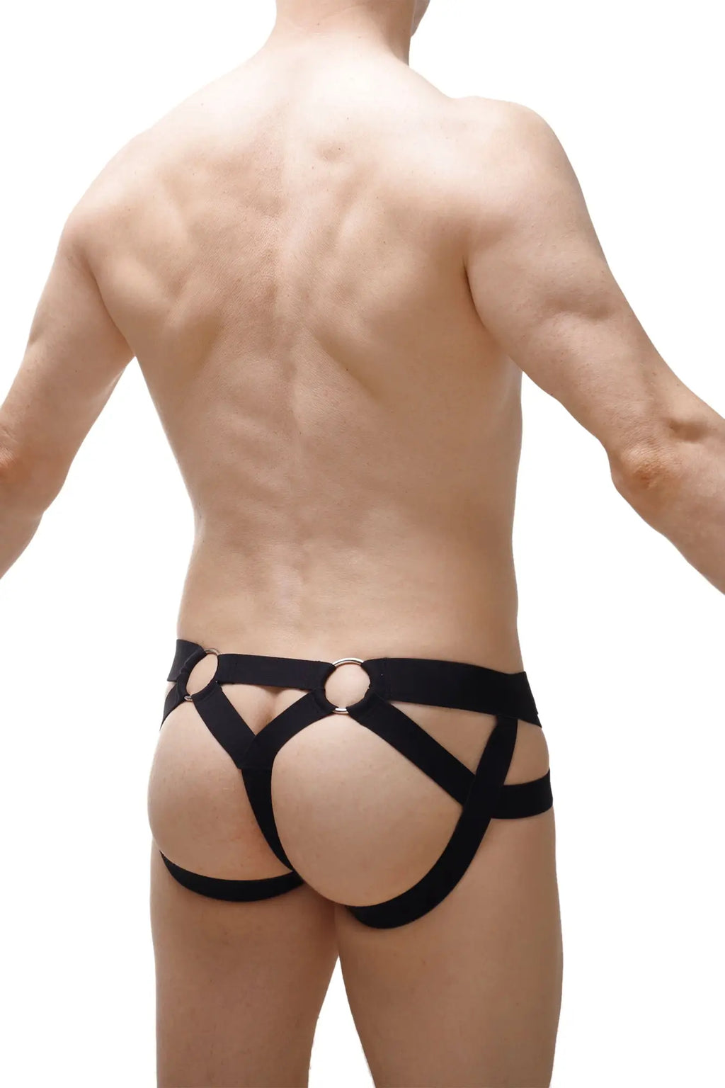 Black leather harness-style briefs with circular metal rings by petitq in 2023 showing front side design