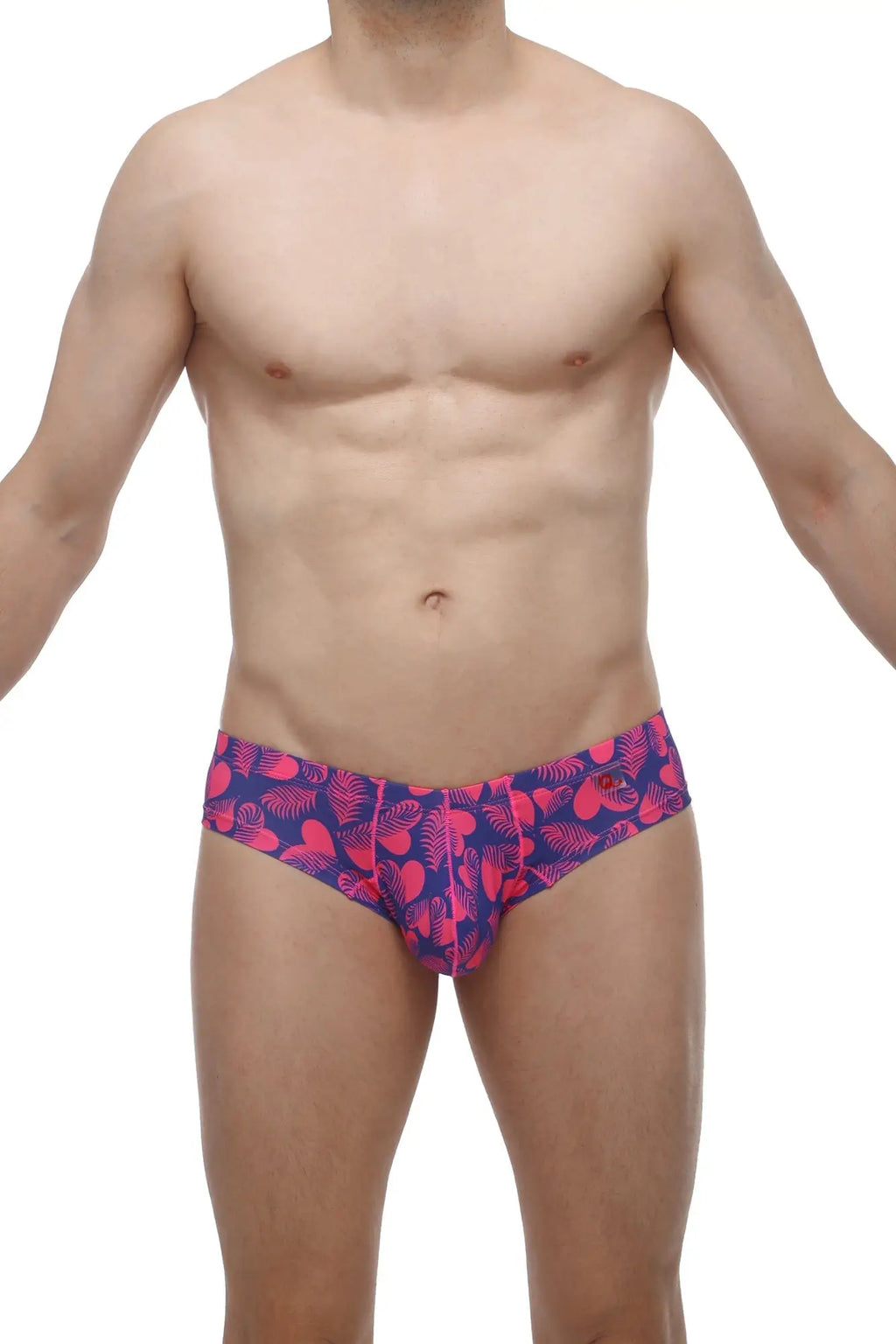 Petitq mini boxer tropical hearts swim trunks with vibrant pink and navy blue tropical leaf pattern