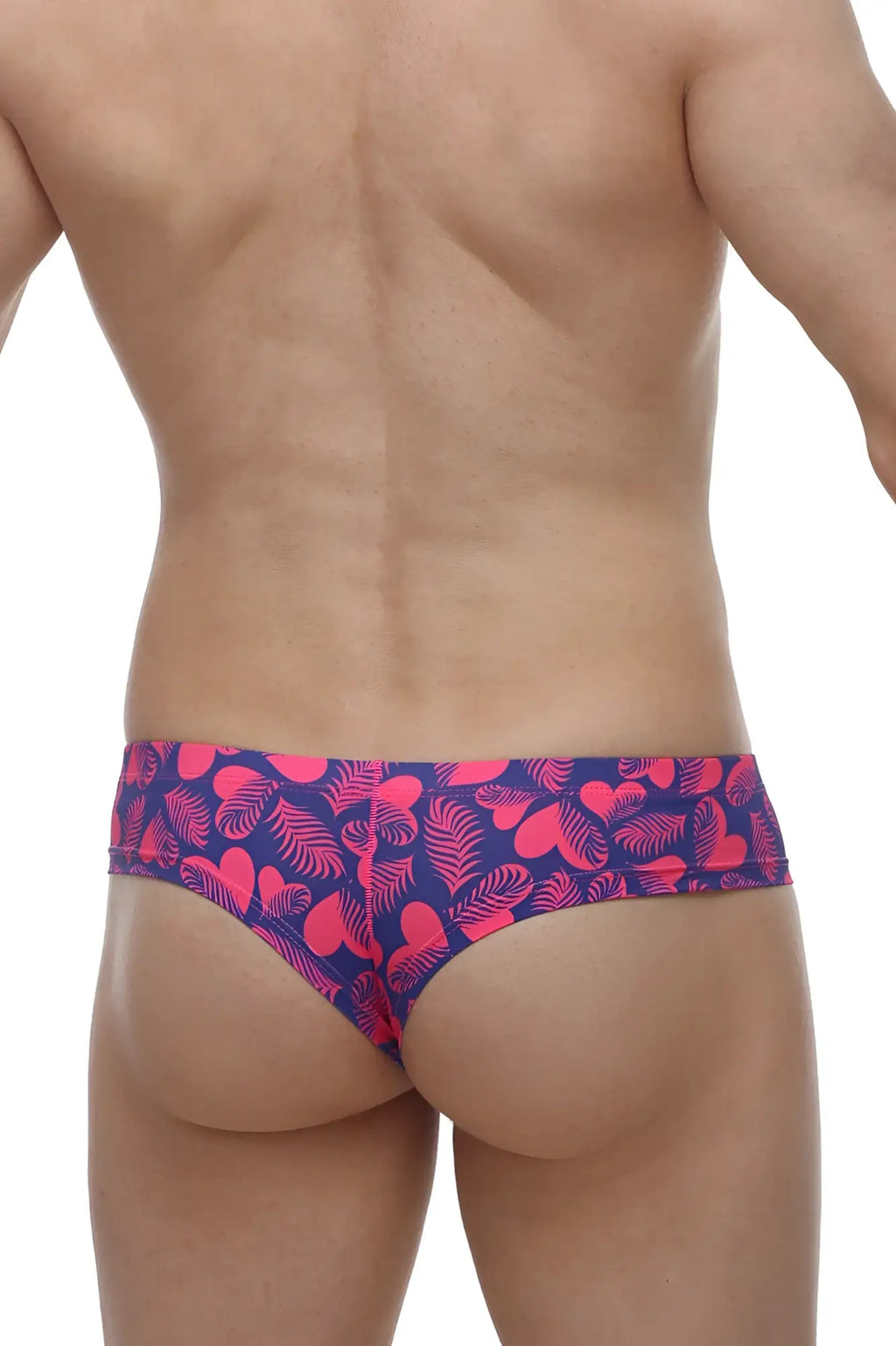 Petitq mini boxer swim trunks in vibrant pink and navy blue with tropical leaf pattern for kids