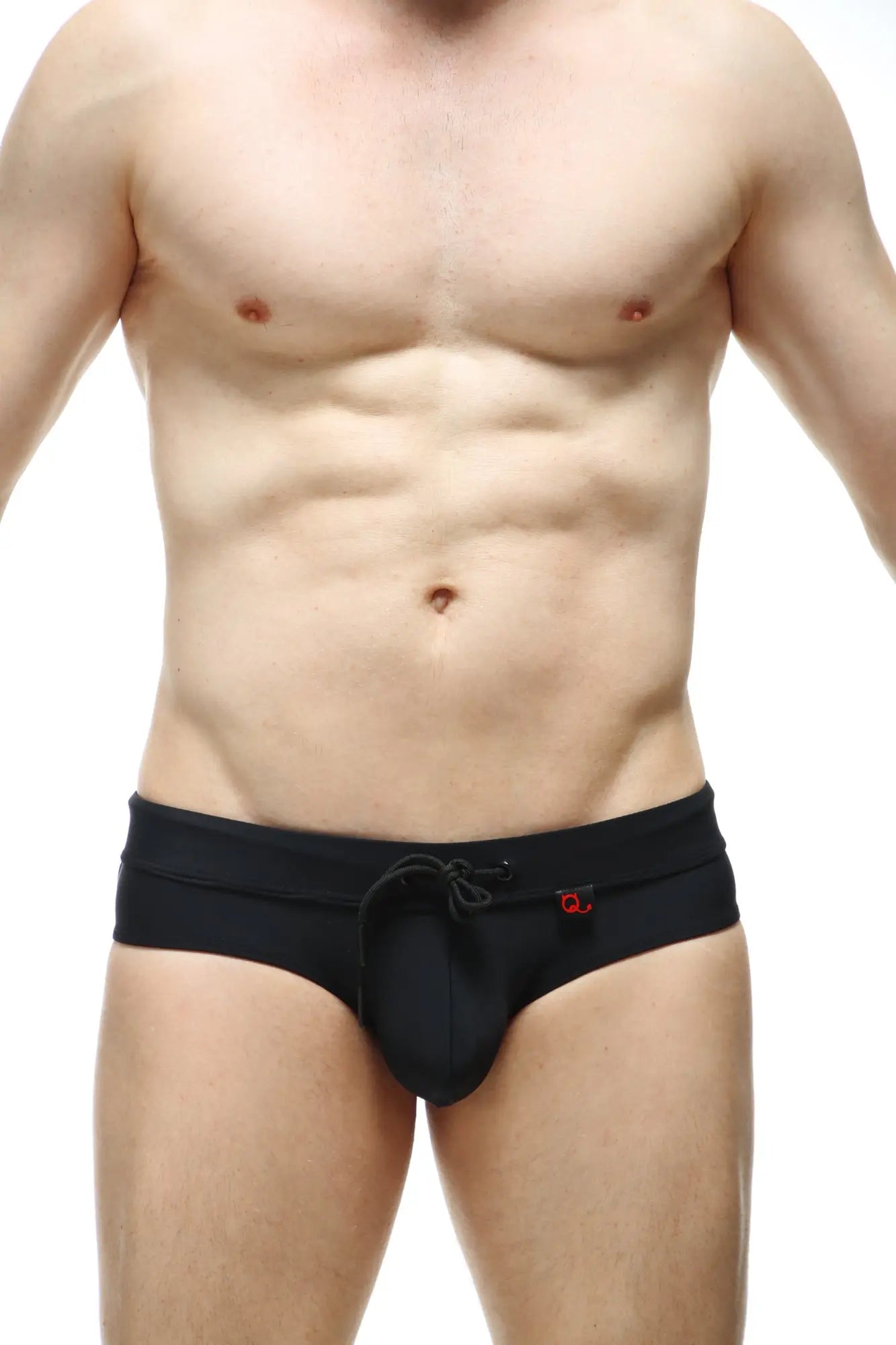Black PetitQ swim bikini Ajoupa swim trunks with drawstring waistband and small red logo on side