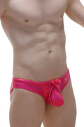 Vibrant pink shiny mesh swim trunks with tied bow at waistband from petitq swim bikini gloss collection