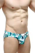 PetitQ swim bikini Macouba tropical leaf-patterned swim trunks in white and teal for beachwear