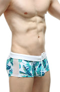 Men’s petitq swim boxer macouba tropical leaf-patterned swim trunks with white waistband and mesh side panels
