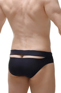 Back view of petitq swim brief mimet recycled black showing black form-fitting swim trunks with horizontal cutout