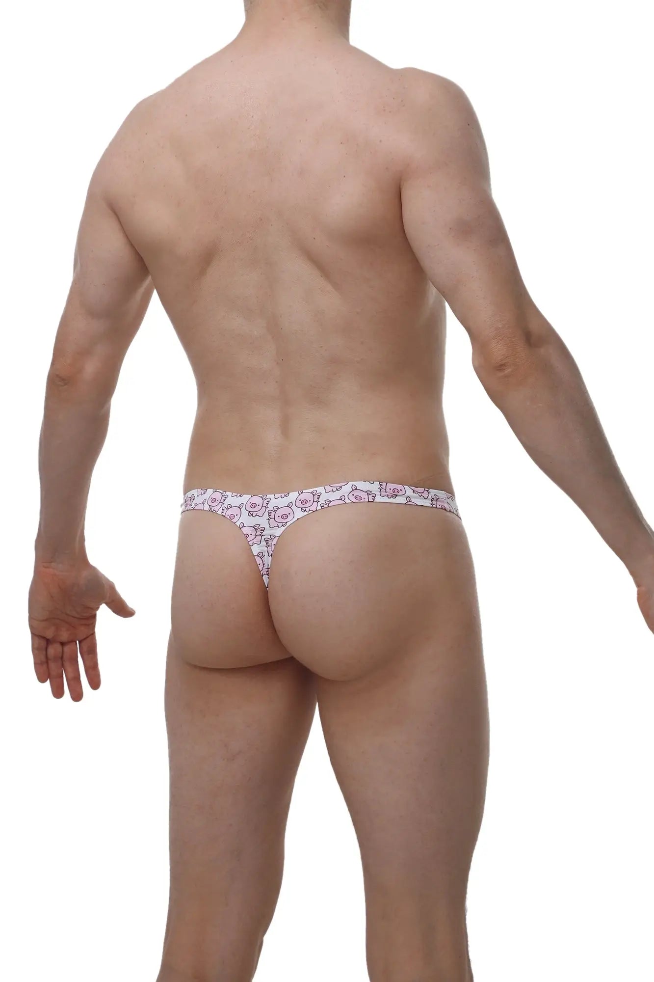 White thong with a repeating pink chill piggy love cartoon pattern from petitq shown from the back side