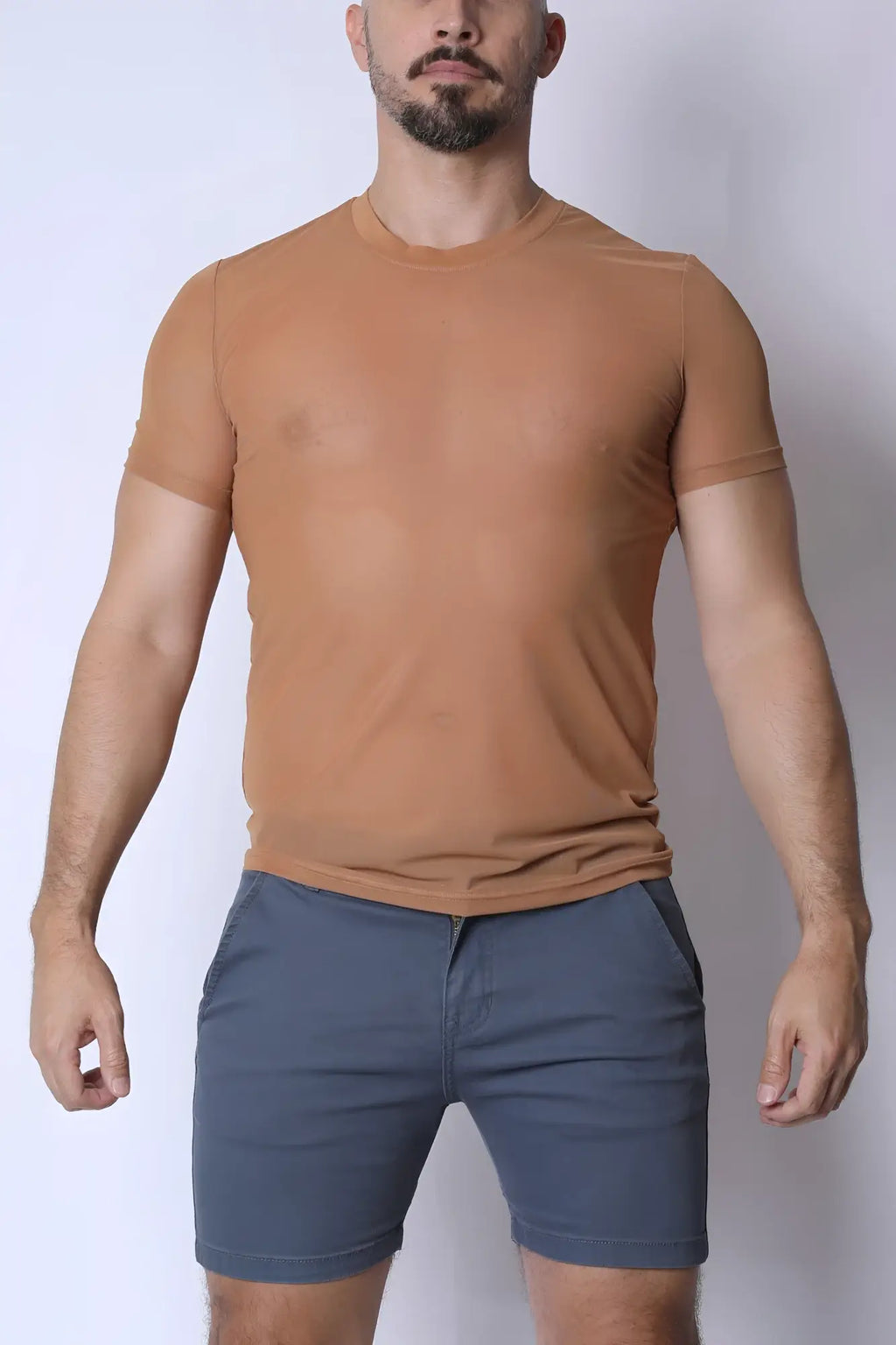 A fitted tan phantom mesh t-shirt with short sleeves and a crew neck made from breathable fabric