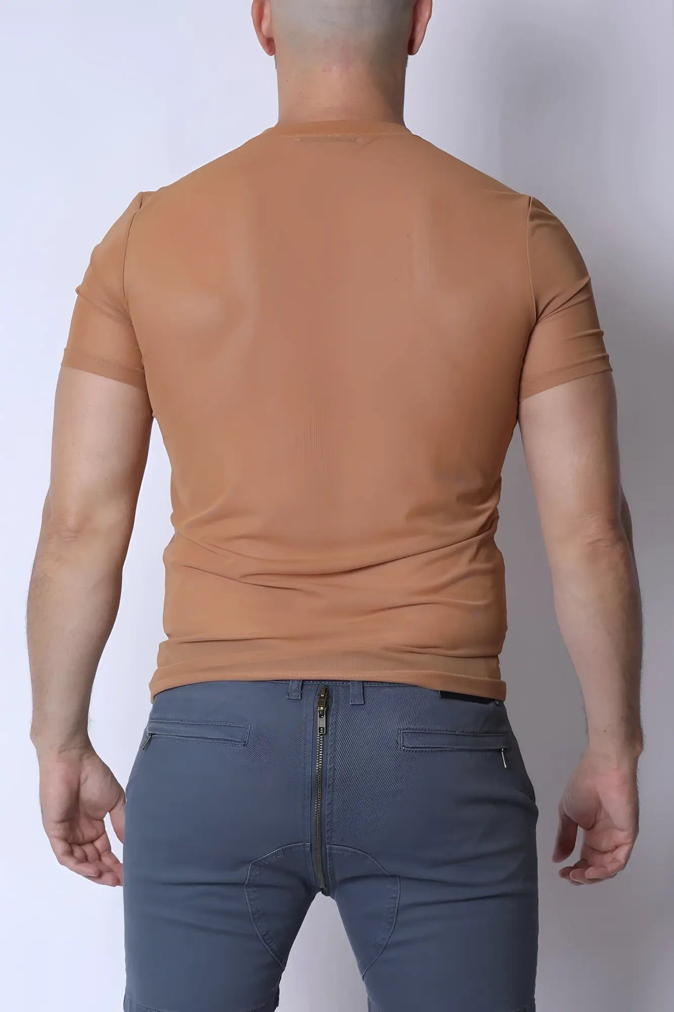 A fitted short-sleeved tan phantom mesh t-shirt with crew neck made from breathable lightweight material