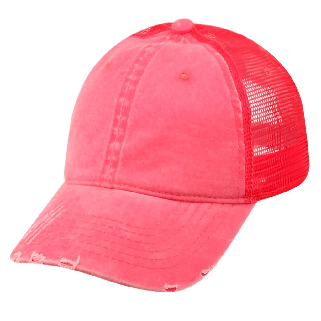 A vibrant coral pink pigment dyed washed cotton trucker cap with distressed fabric front and matching mesh back