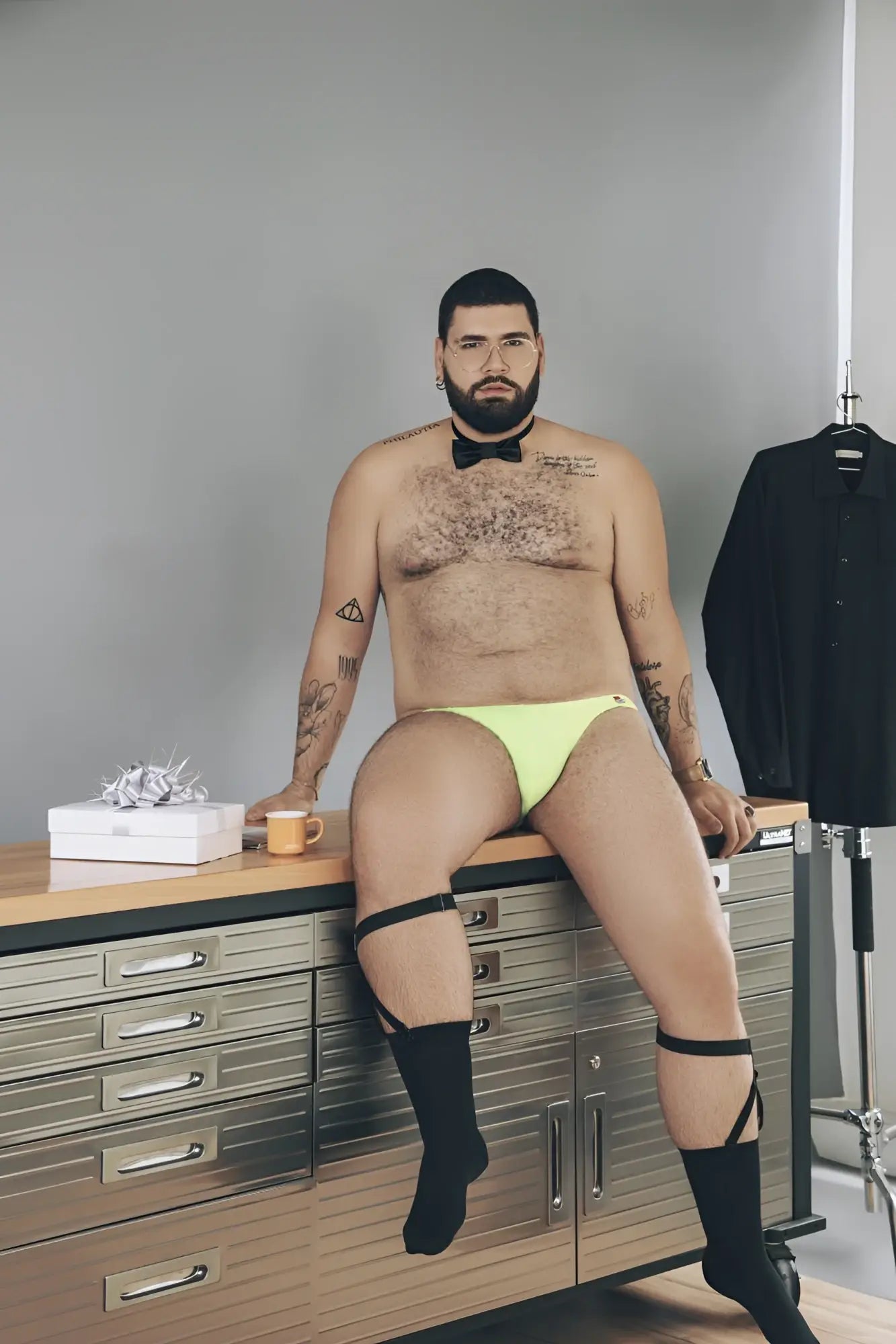 Bright lime green pikante angola thongs with black straps and bow tie detail in front view