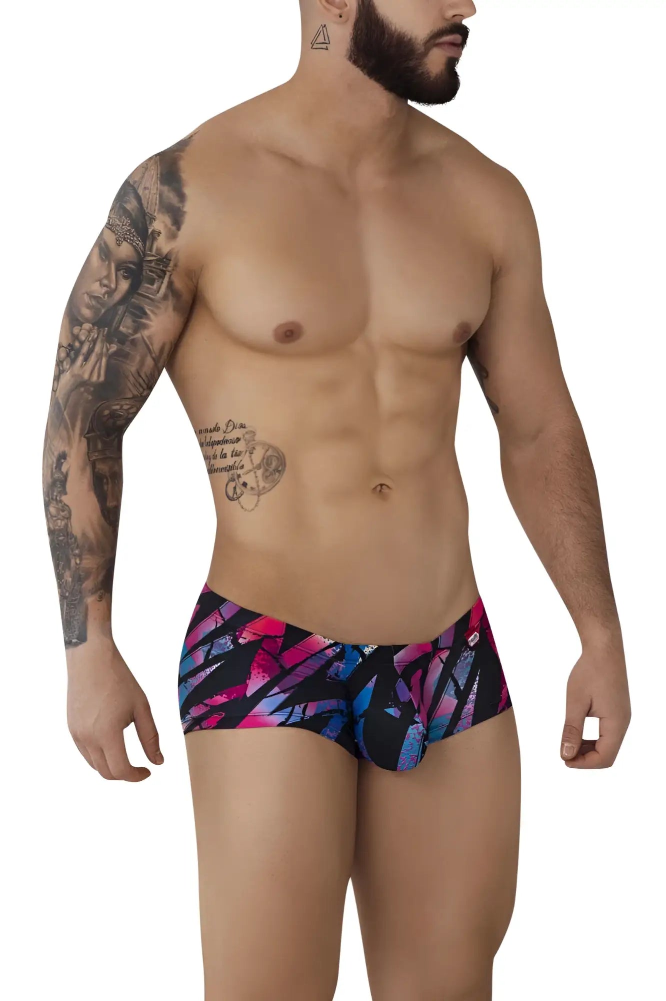 Vibrant abstract patterned pikante pik 0988 jartum swim trunks in bold pink and blue hues on black background