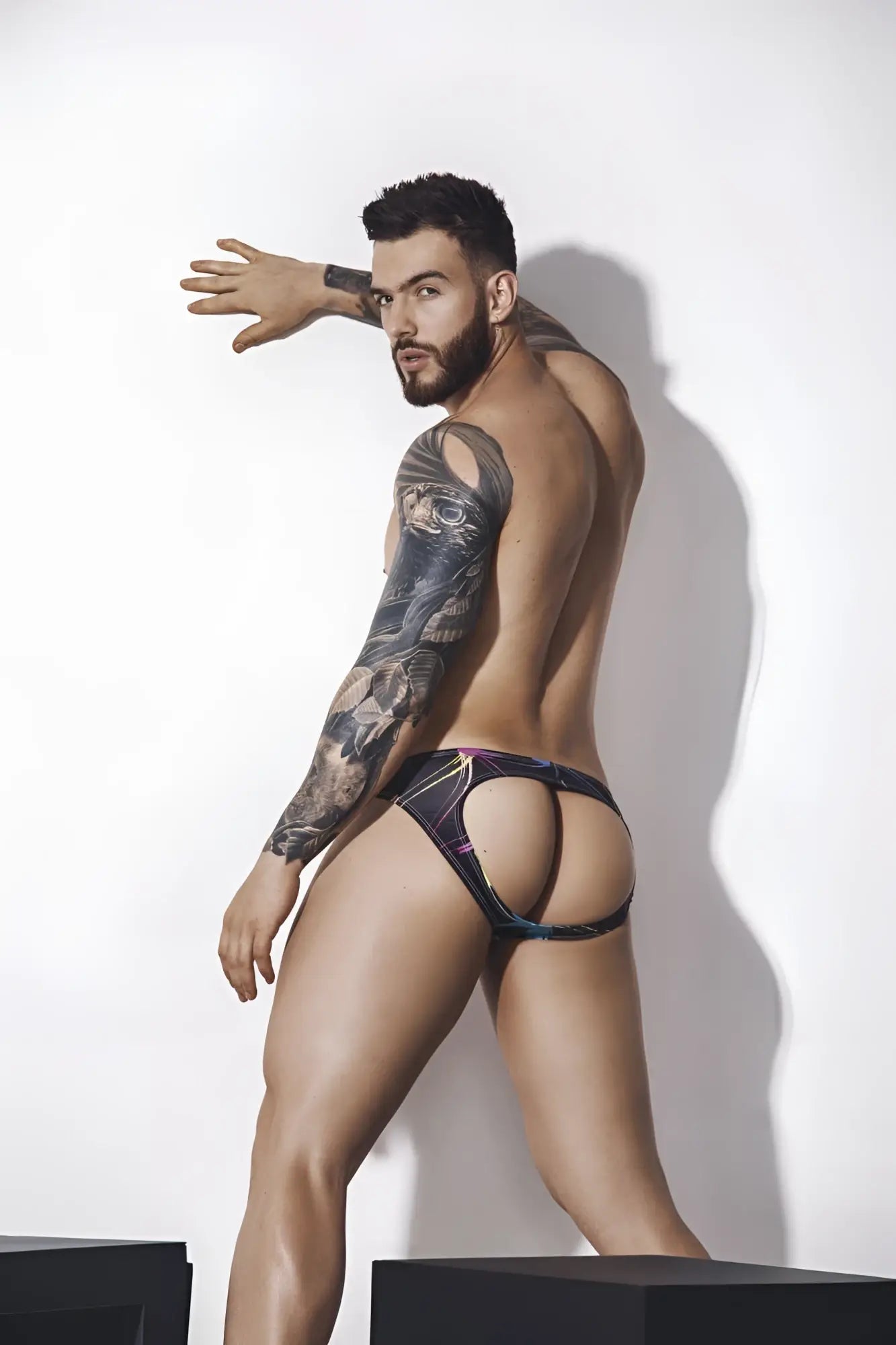 Black and purple patterned Pikante PIK 1076 Nucleus jockstrap briefs with cut-out design visible from the back side