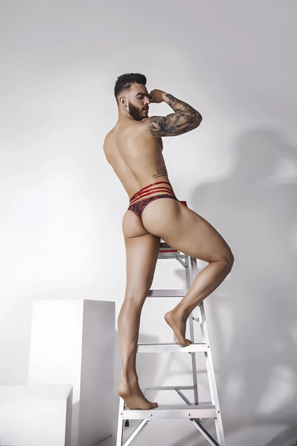 Red and black striped briefs with a patterned design from pikante PIK 1081 fiery thongs collection in vibrant red