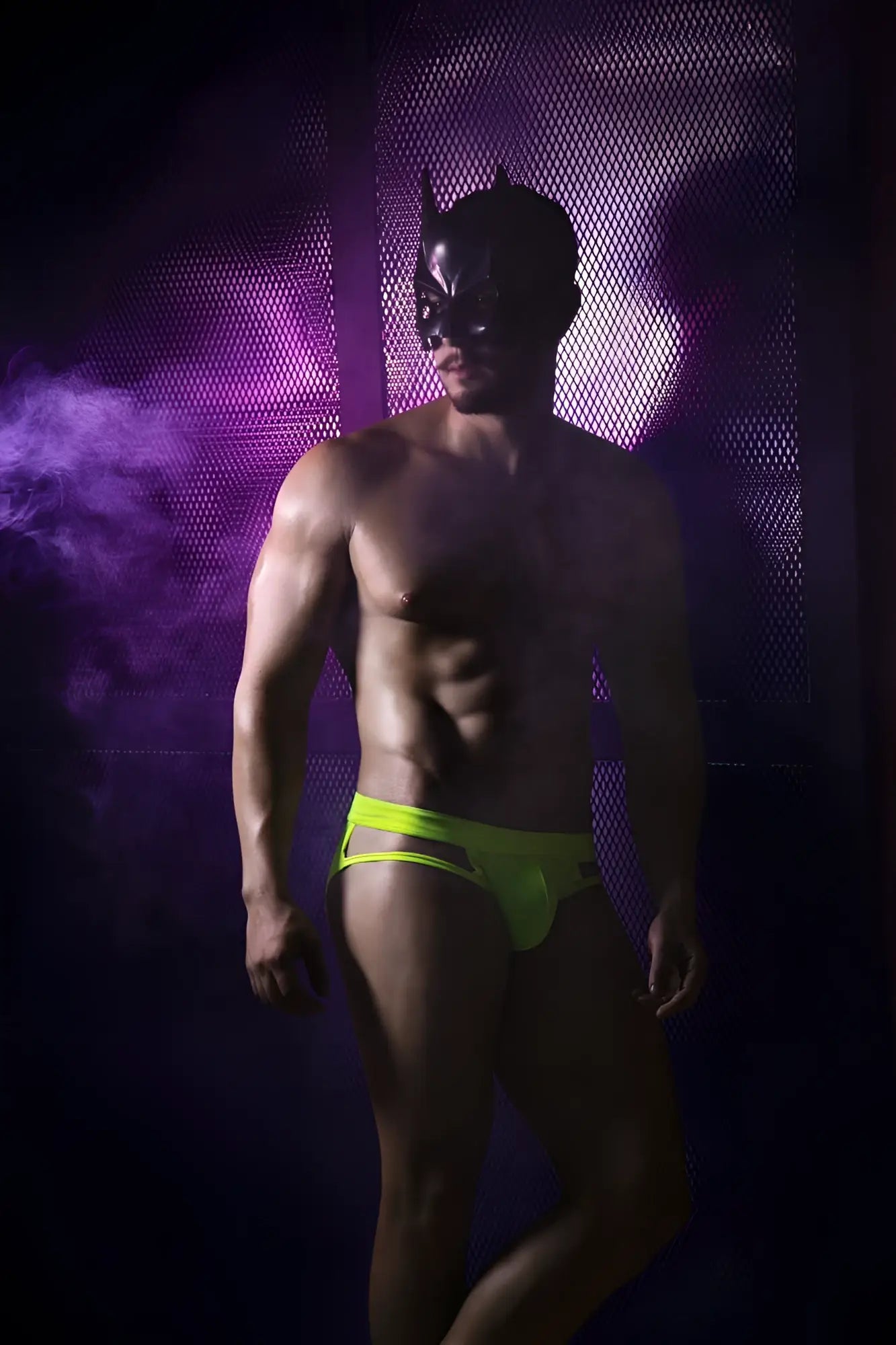A man wearing a black batman mask models pikante pik 2114 lenox neon green briefs in a front view