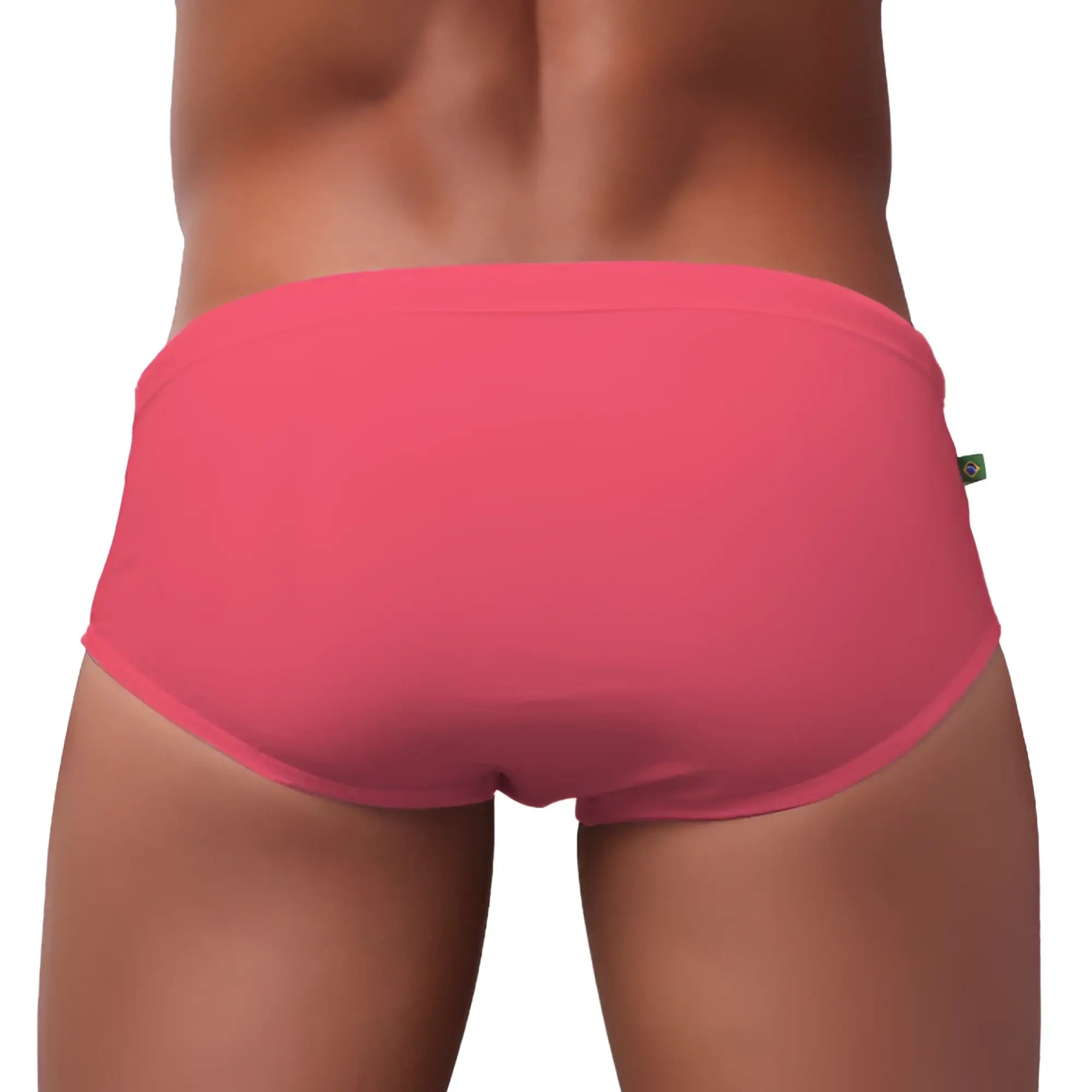 Bright pink men’s swimming sunga briefs made of smooth stretchy fabric with a simple elastic waistband for beachwear