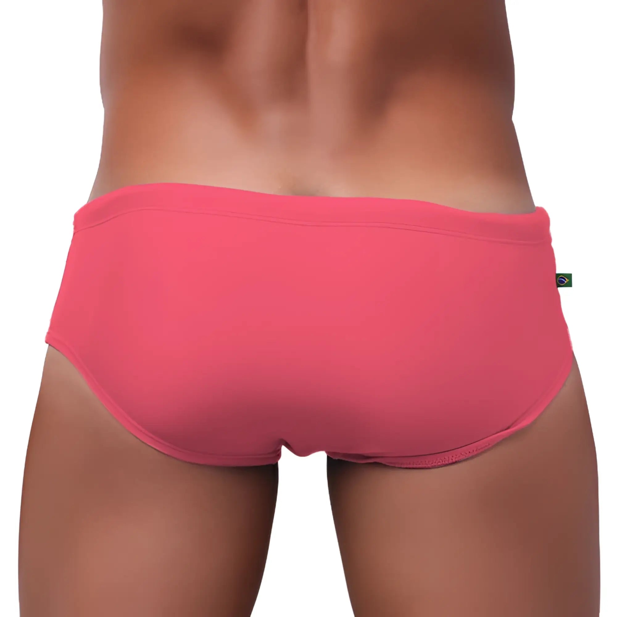 A vibrant coral pink swim trunks made of smooth form fitting fabric with a subtle elastic waistband for men’s beachwear