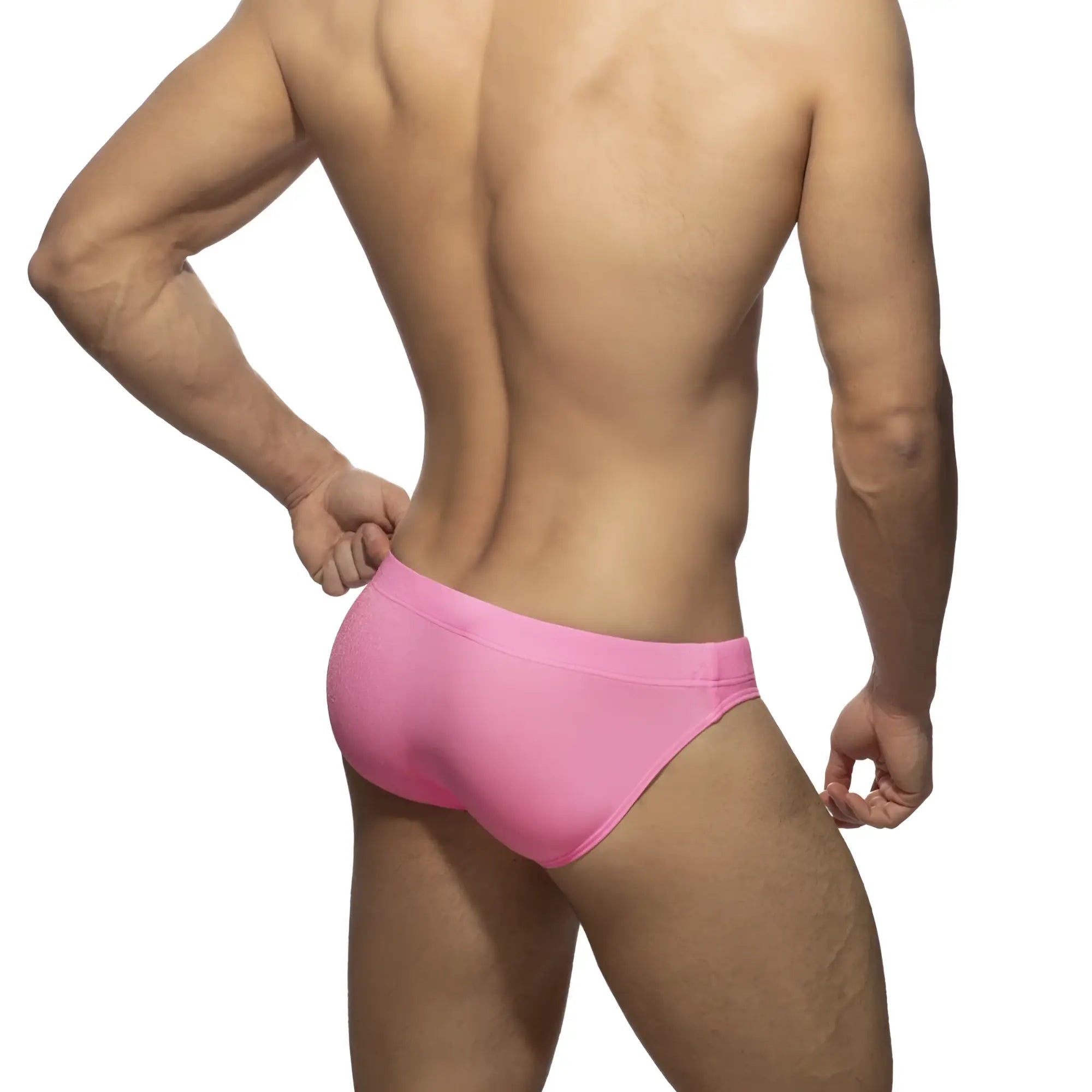 Pink athletic briefs made of pique fabric designed for speed and comfort in swimwear use