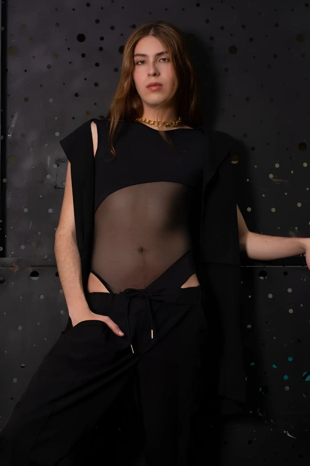 Black sheer PLURAL PL002 bodysuit with cut-out details and a draped sleeve for stylish wear